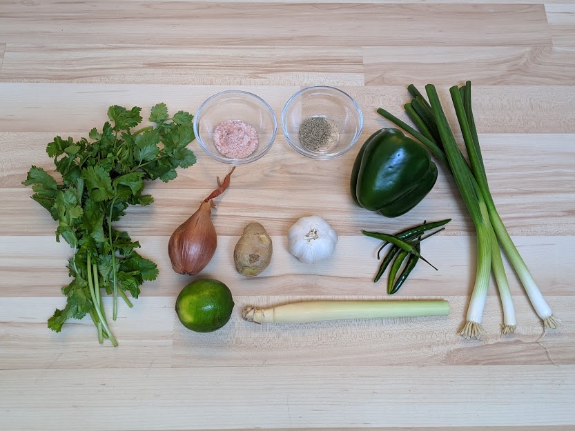 Thai Green Curry paste ingredients laid out on wooden background