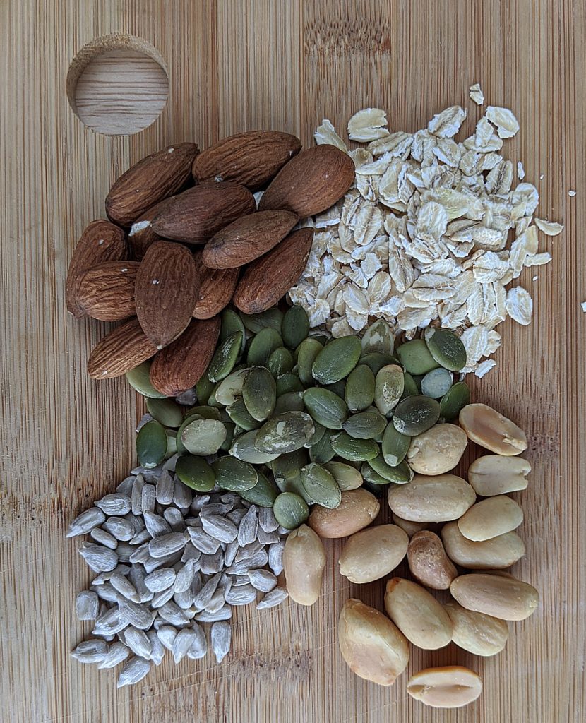 Whole nuts and seeds (almonds, pumpkin seeds, oats, peanuts and sunflower seeds) before chopping