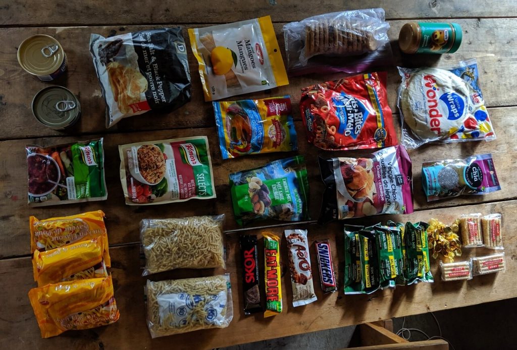 Overhead view of packaged foods on wooden table