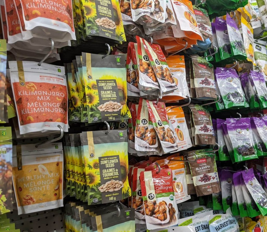 Side view of seed and nut packages in dollar store